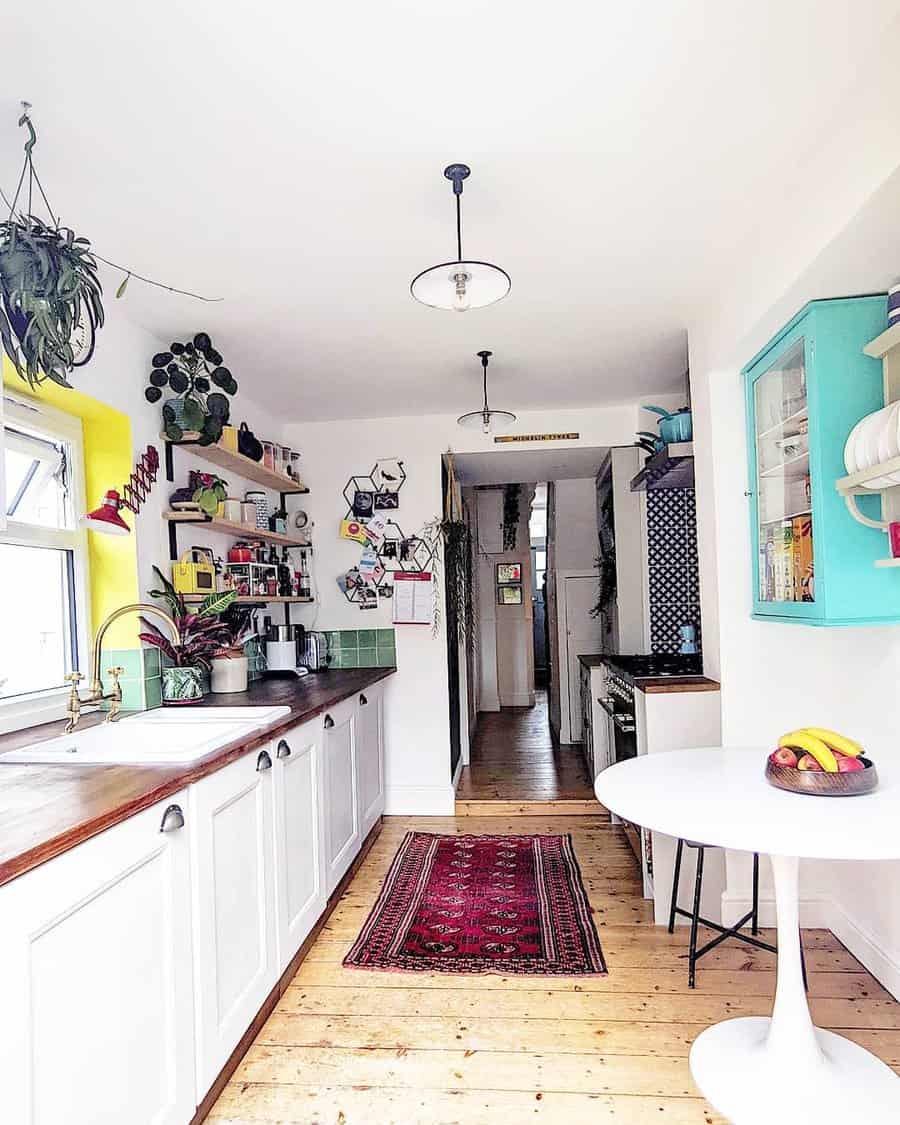 Eclectic kitchen with colorful accents and plants