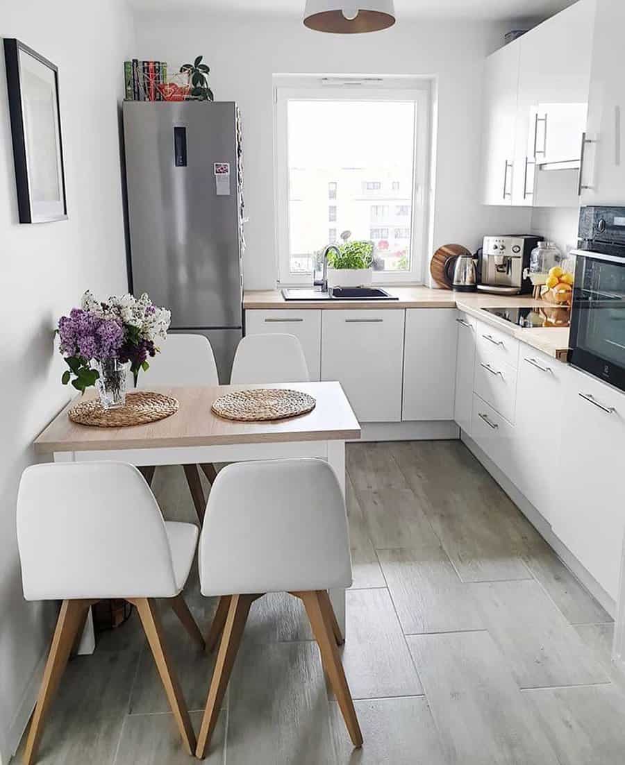 Scandinavian style kitchen-dining area with natural light