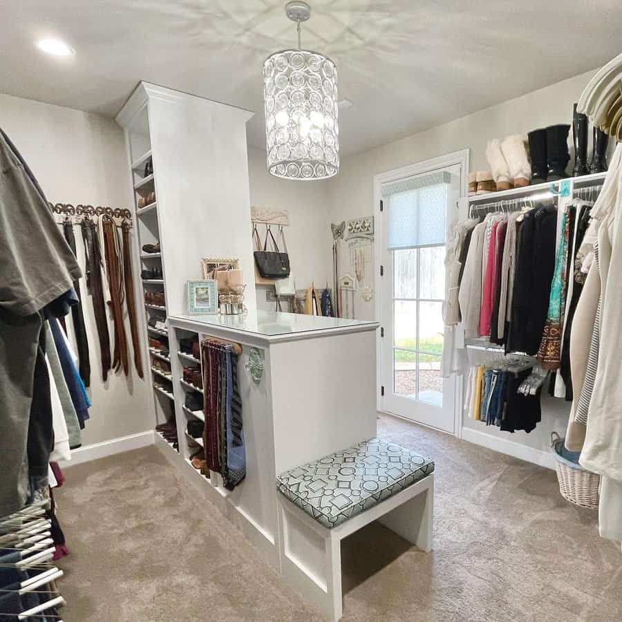 walk-in closet with island cabinet