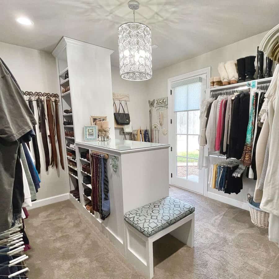 Walk in closet with island cabinet