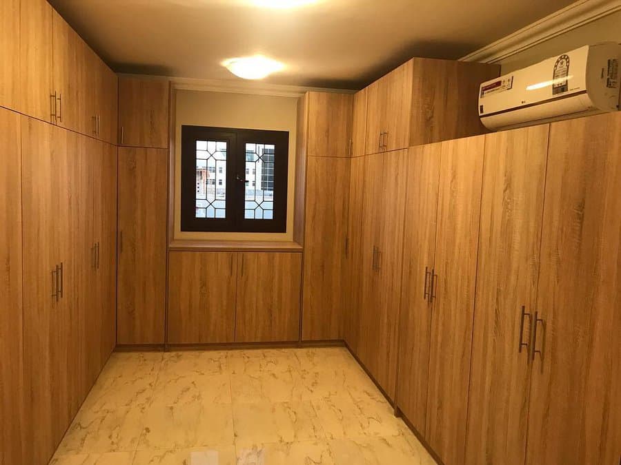 Walk in closet with enclosed storage