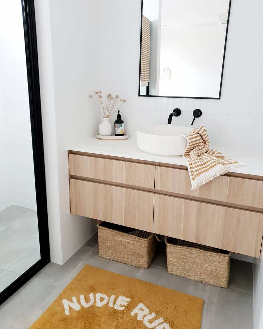 Chic bathroom with blue walls and wooden accents