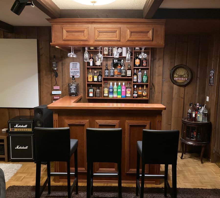 A cozy home bar with a wooden counter