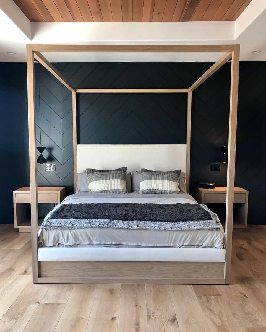 Bedroom with canopy bed and wooden floors