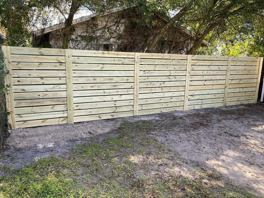 Wooden slat fence in the backyard