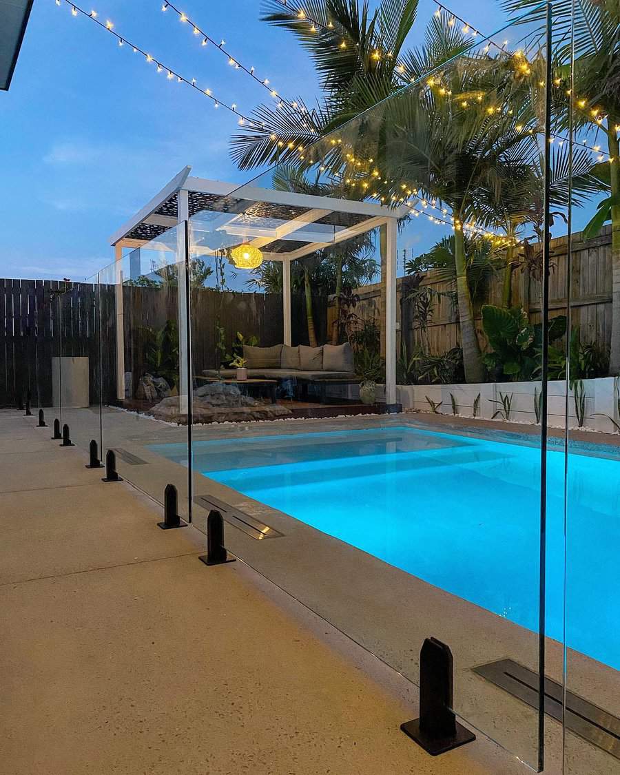 Wood pool fence with a glass fence