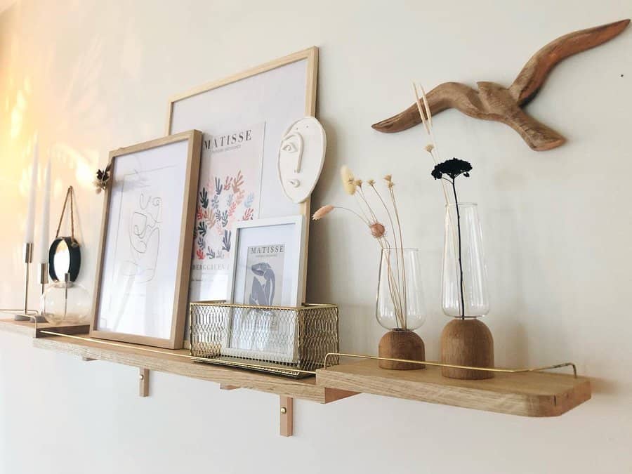 Mini wall shelf with decor and frames