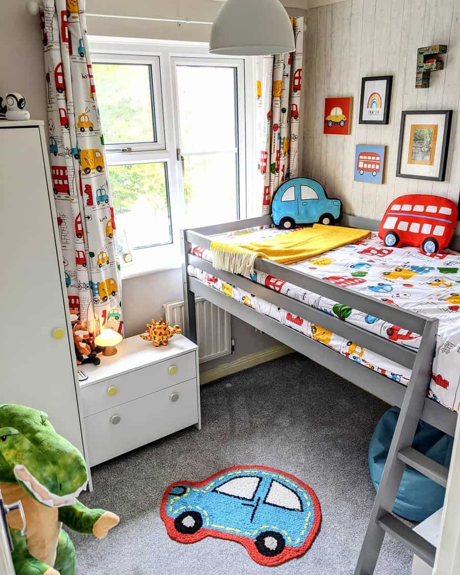 Kid's room with a car-themed loft bed, colorful curtains, stuffed dinosaur, and car decor; bright window and carpet with a car design