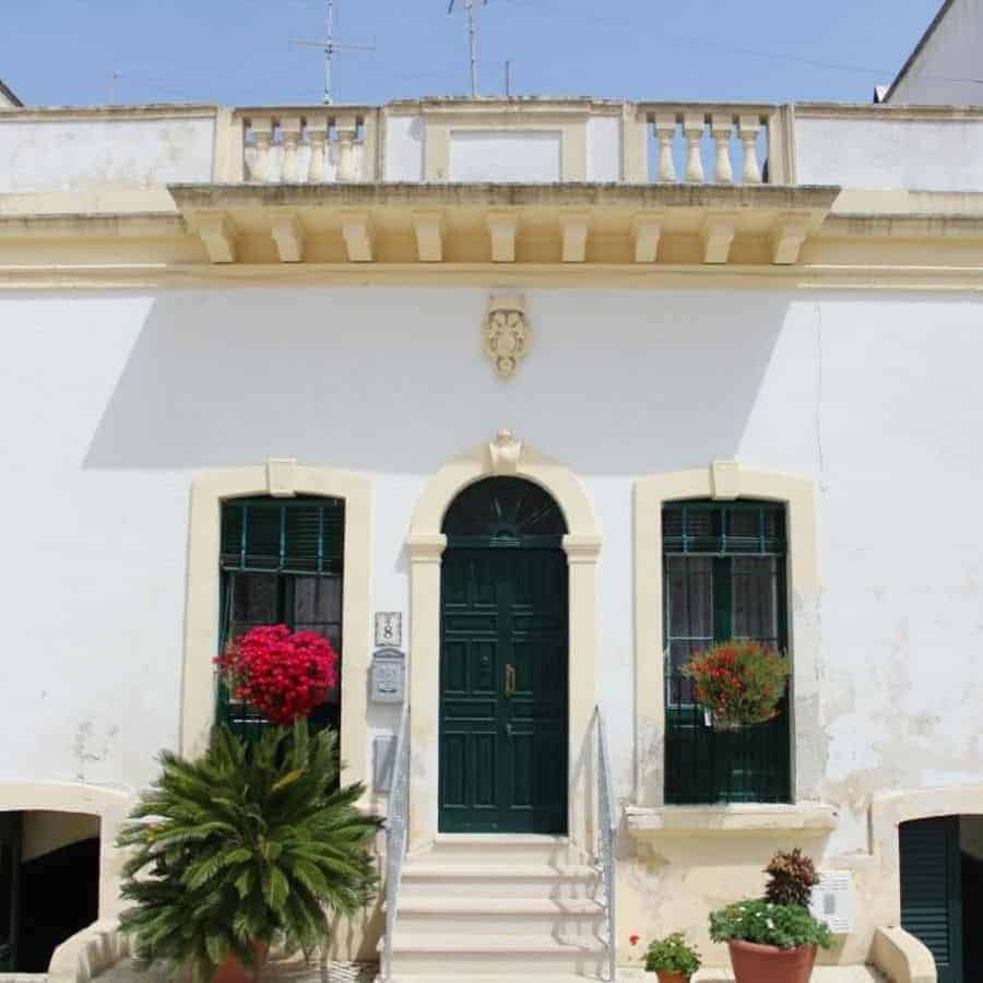 Old-Fashioned Mediterranean House Surrounded With Plants 
