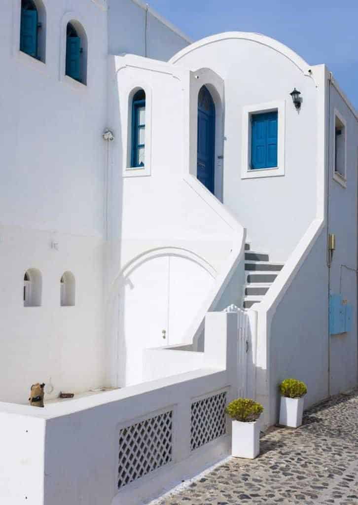 White mediterranean house with blue windows