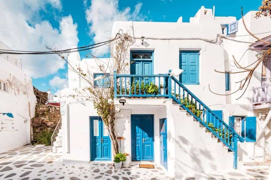 White mediterranean house with blue windows