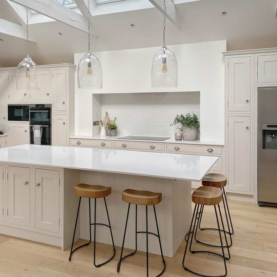 Bright kitchen with skylight and glass pendants