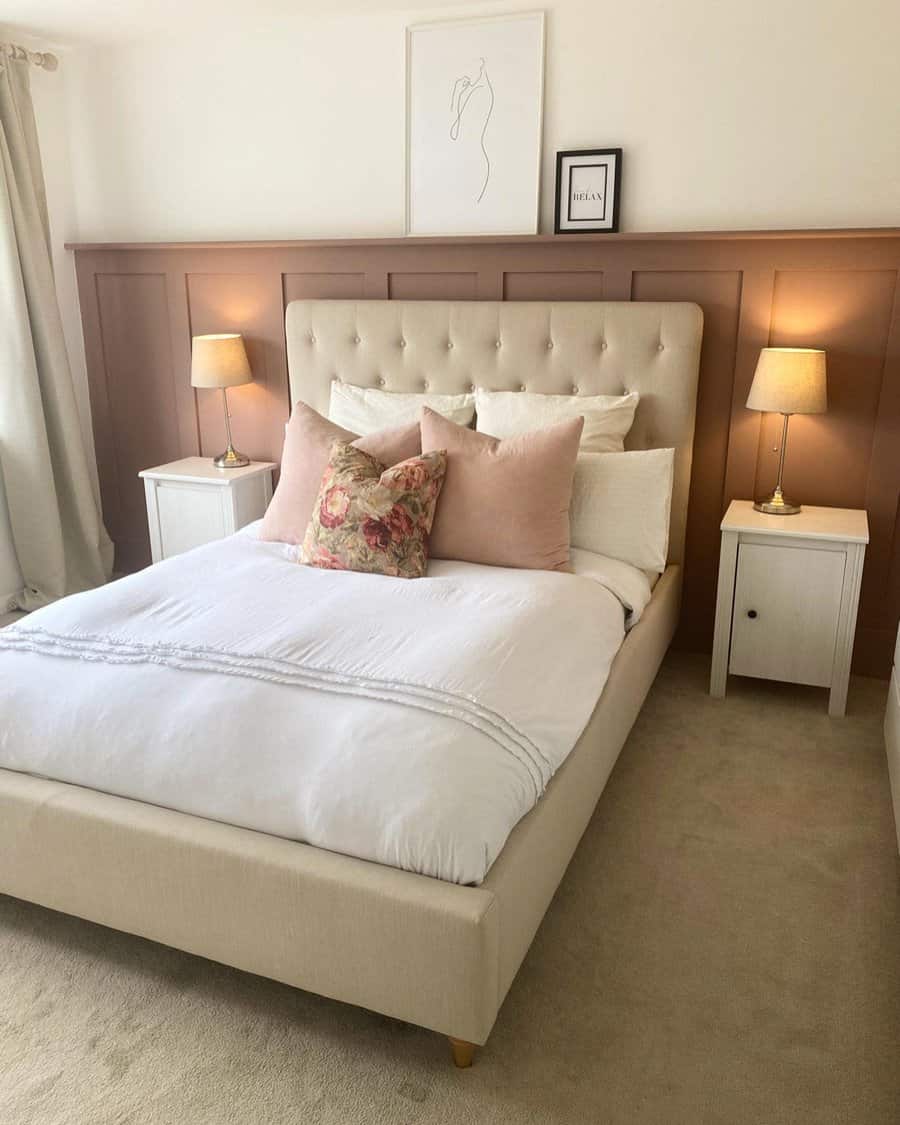 Cozy bedroom with beige tufted headboard and warm lighting