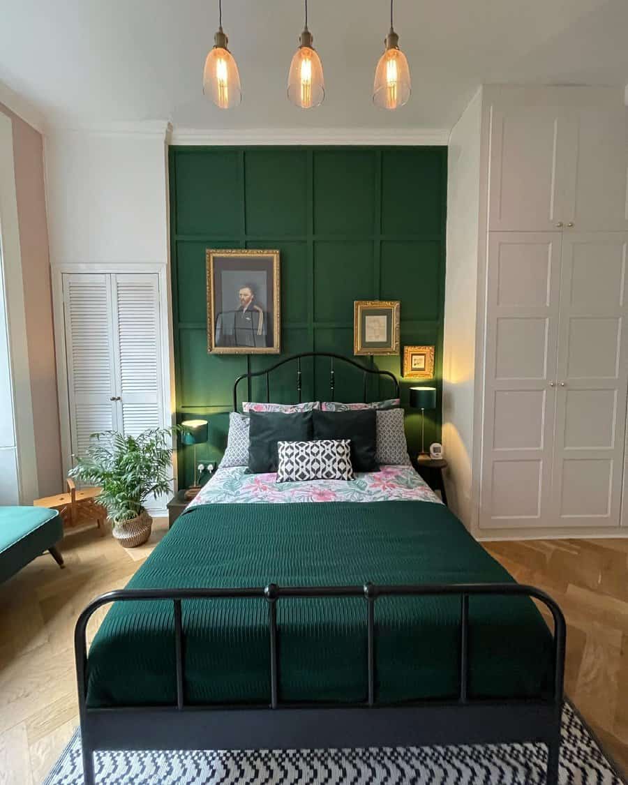 Elegant bedroom with emerald green panel wall and vintage decor