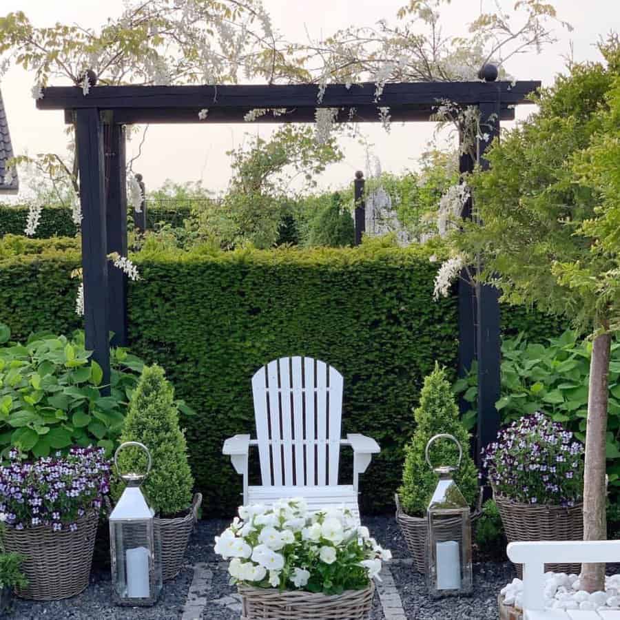 Elegant garden arbor with white chair and flowers