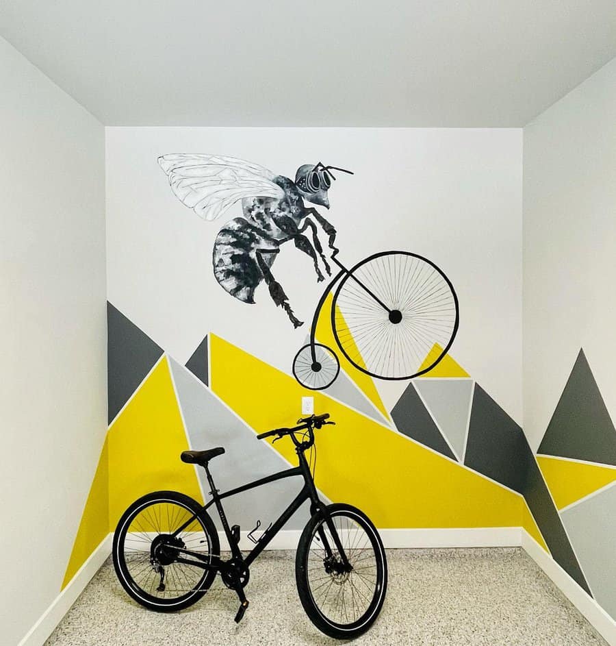 Art mural with bee and bike on geometric background