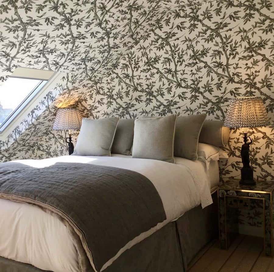 Green and white inspired bedroom attic idea with botanical wallpaper