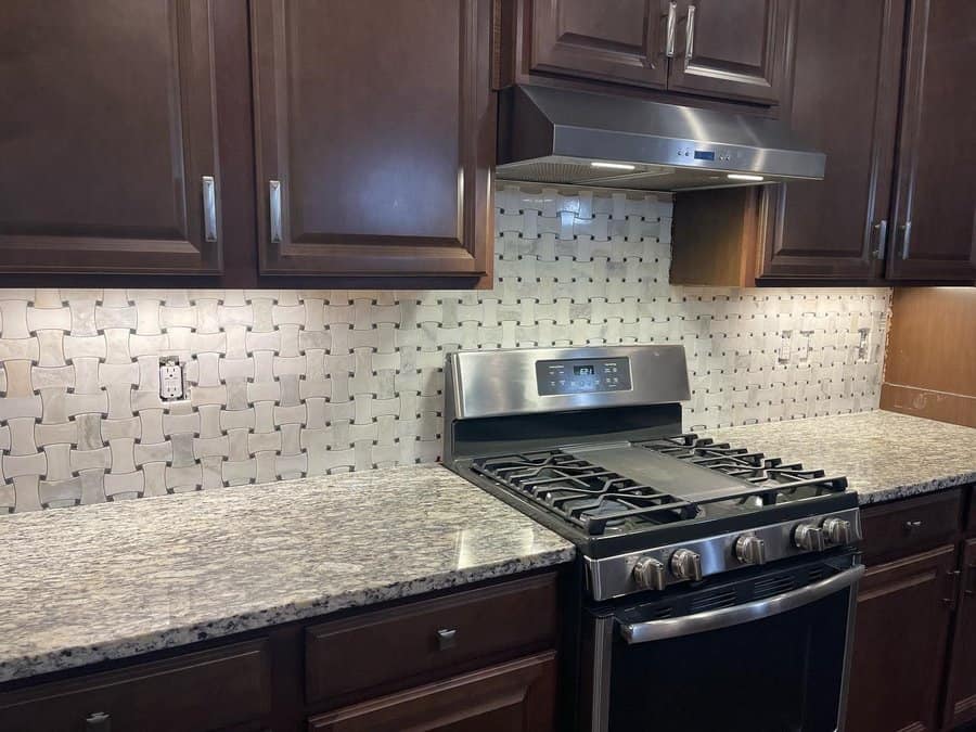 Small kitchen with gray backsplash