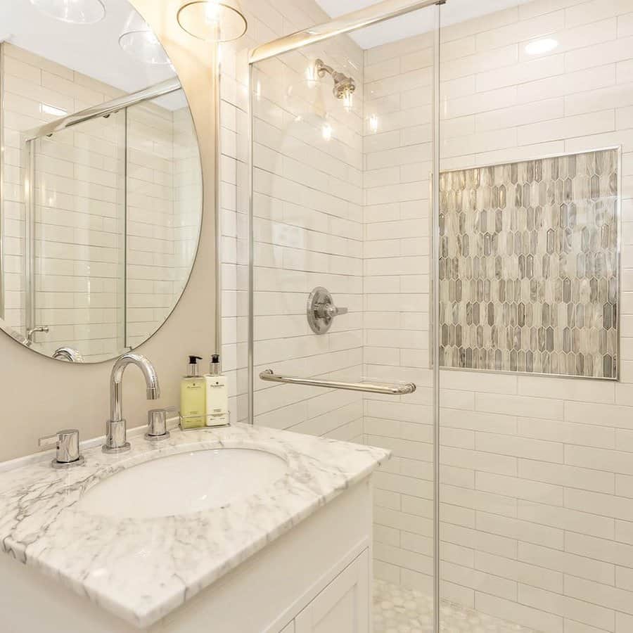 small bathroom with off-white walls and marble sink