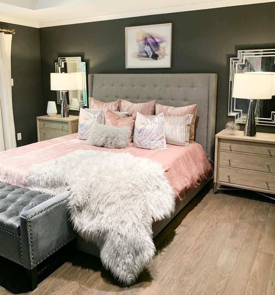 Chic bedroom with grey bed and pink accents