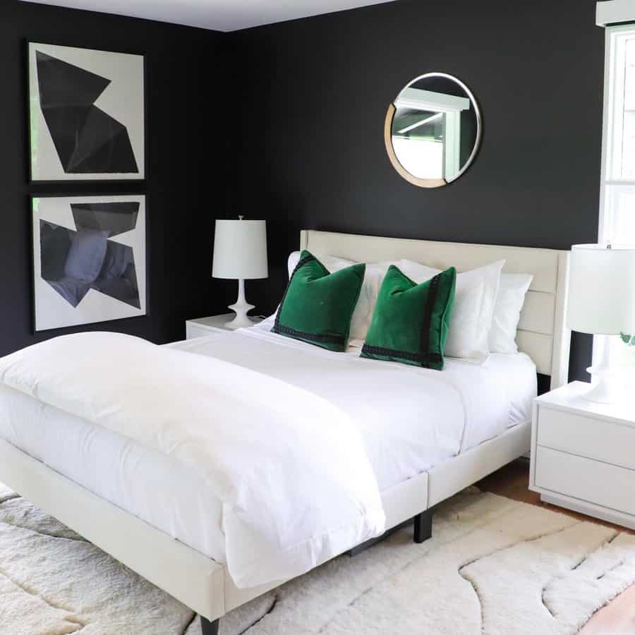 Monochrome bedroom with plush black bed and grey carpet