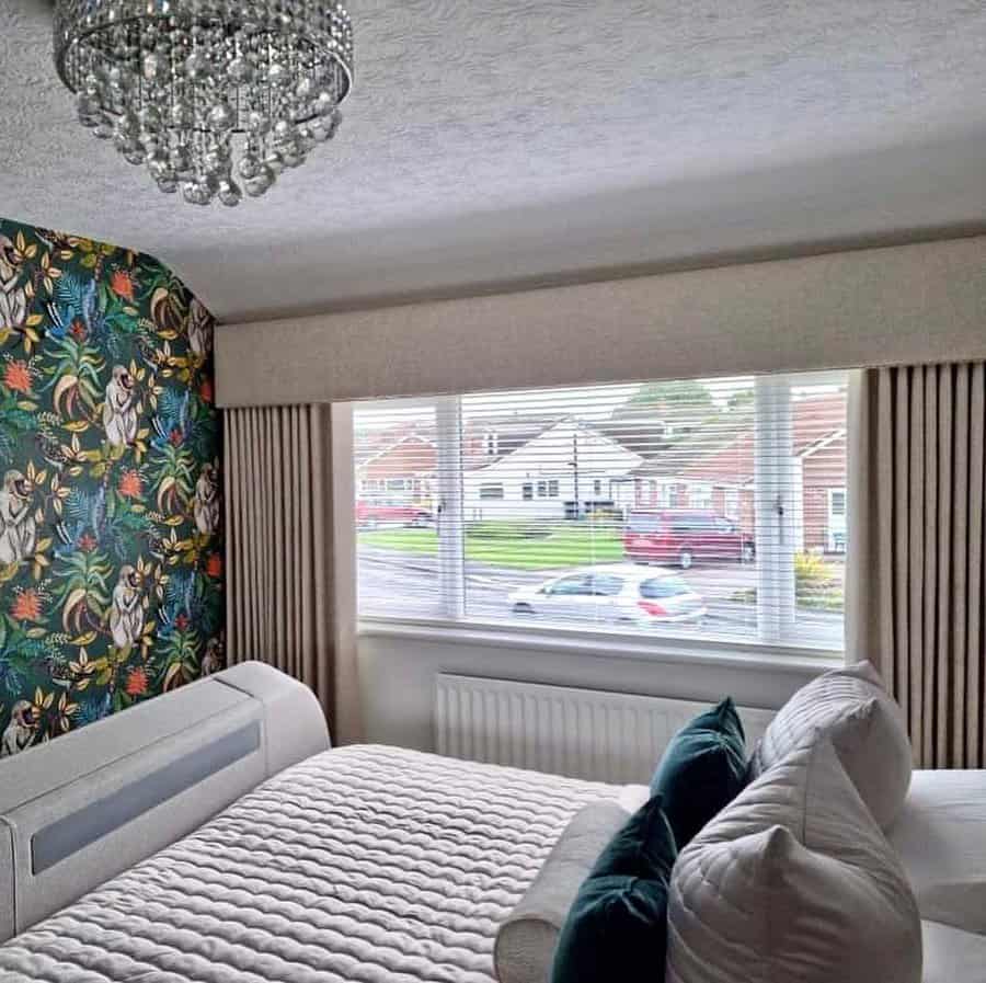 Bedroom with patterned curtain and bead light fixture