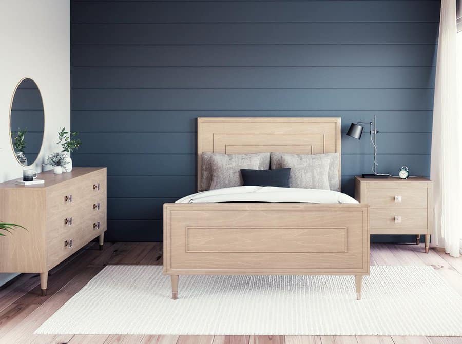 Scandinavian style bedroom with dark blue wall and wooden furniture