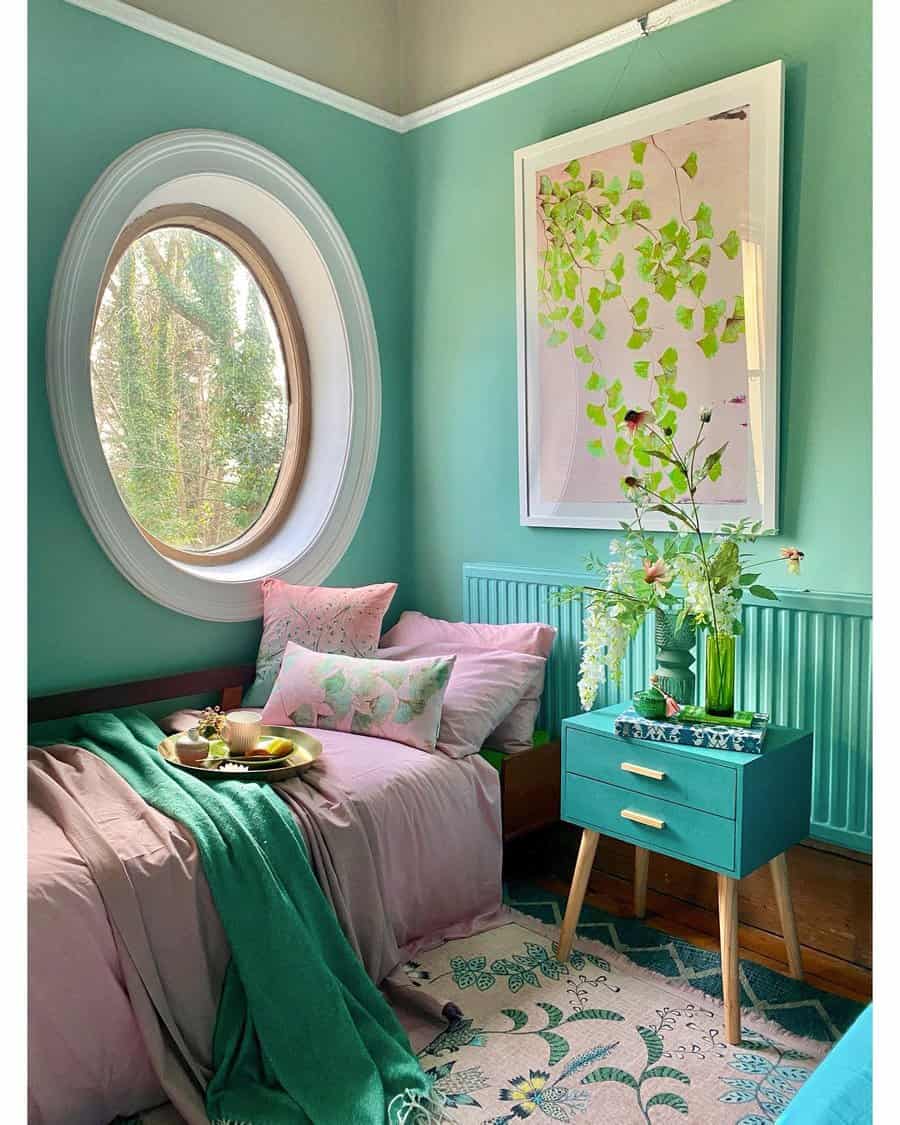 Quaint room with mint walls and oval window