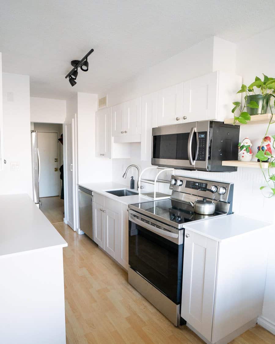 Well lit kitchen with a center island equipped with modern appliances