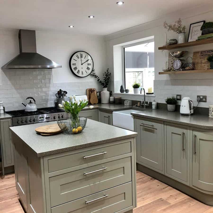 Cozy kitchen with island and large wall clock