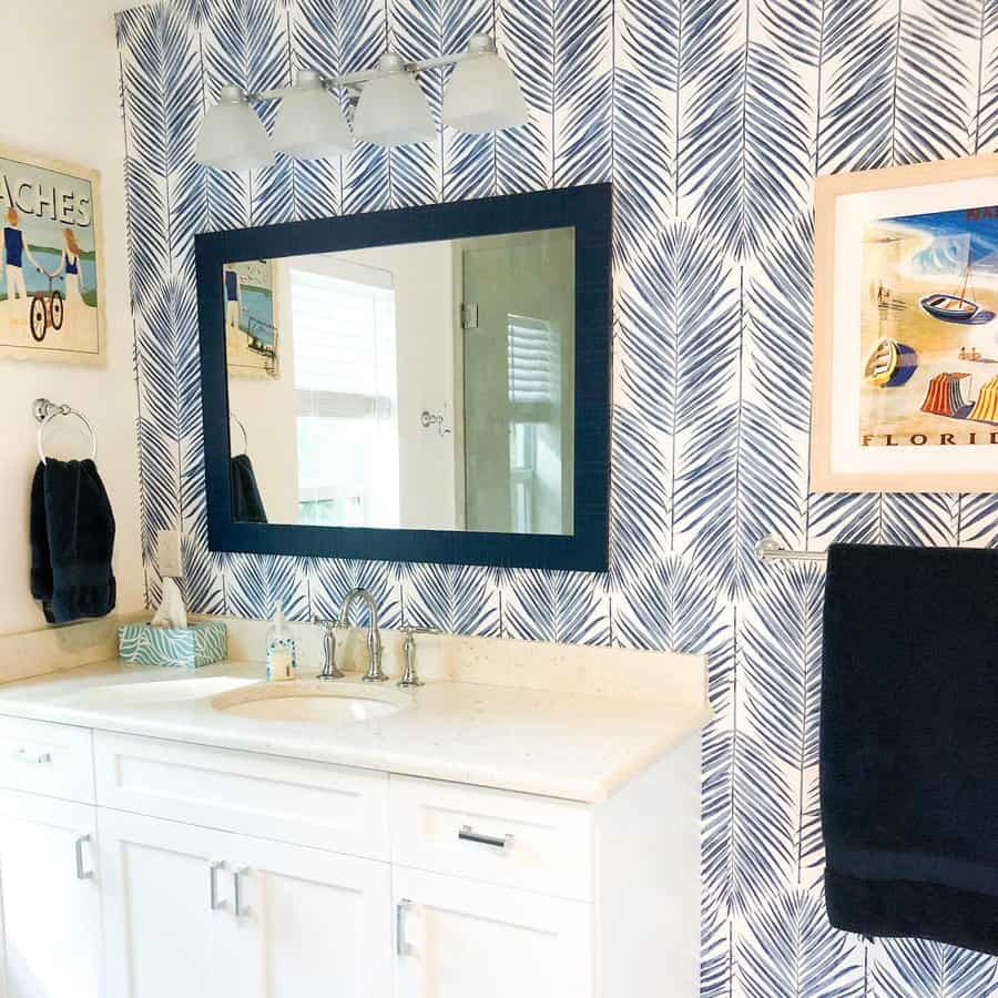 Bathroom with blue coastal wallpaper