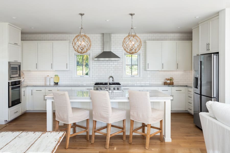 Bright white kitchen with globe pendants