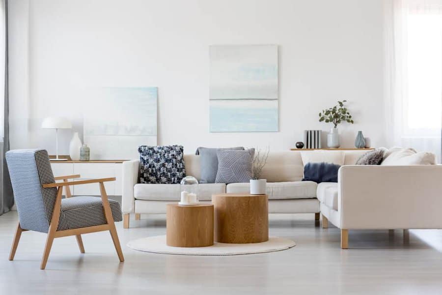 Contemporary white living room with gray cushions 