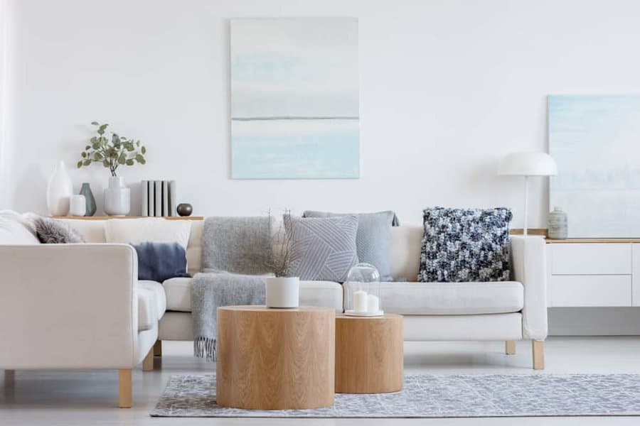 Contemporary white living room with gray cushions 