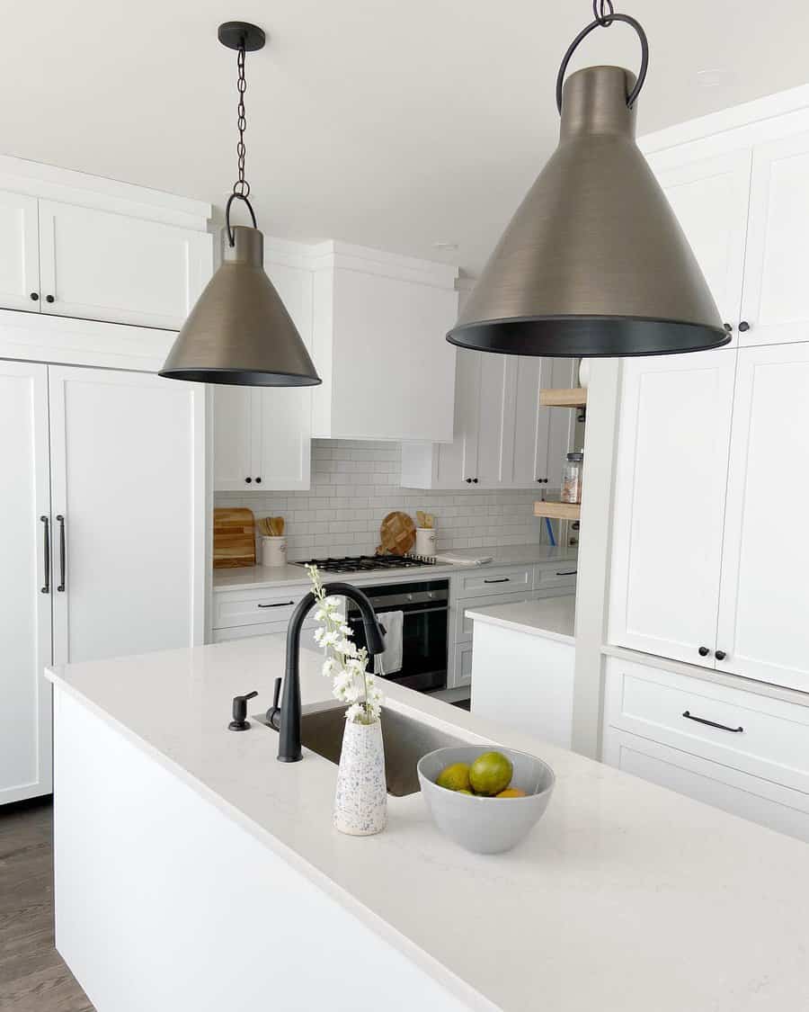 Bright white kitchen with conical pendants