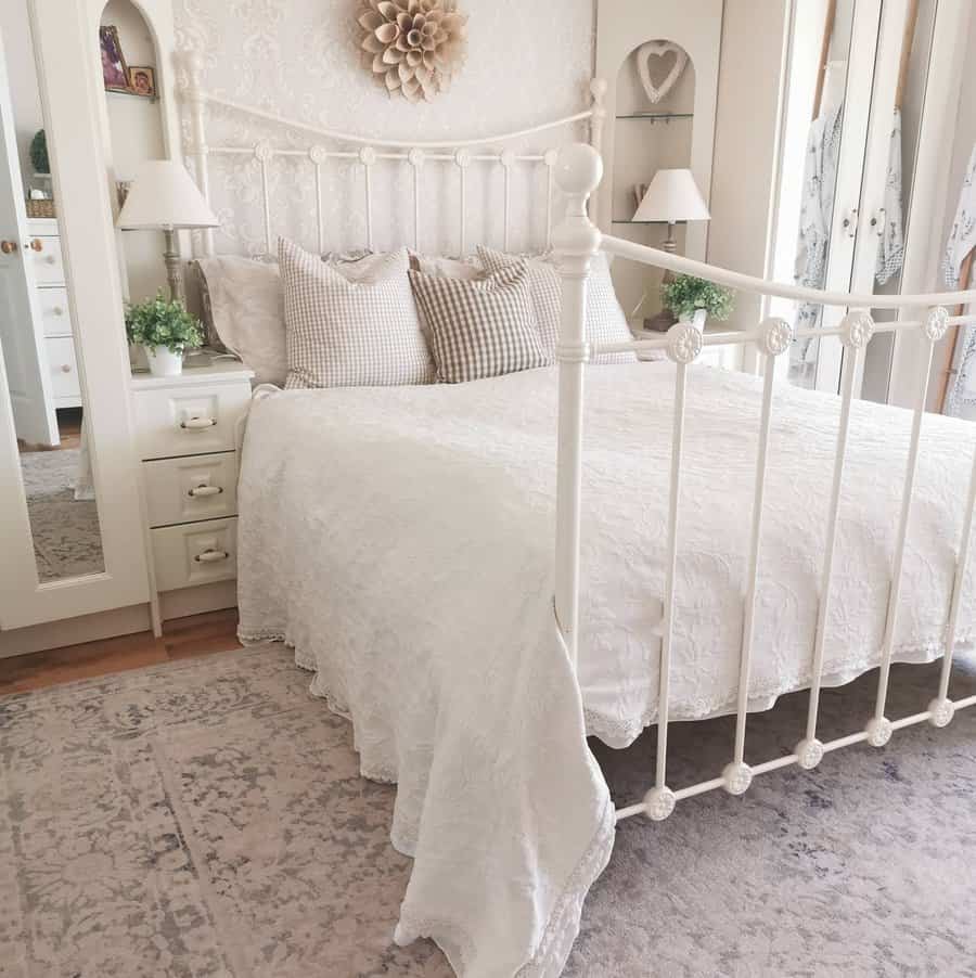 Elegant white bedroom with canopy and rug