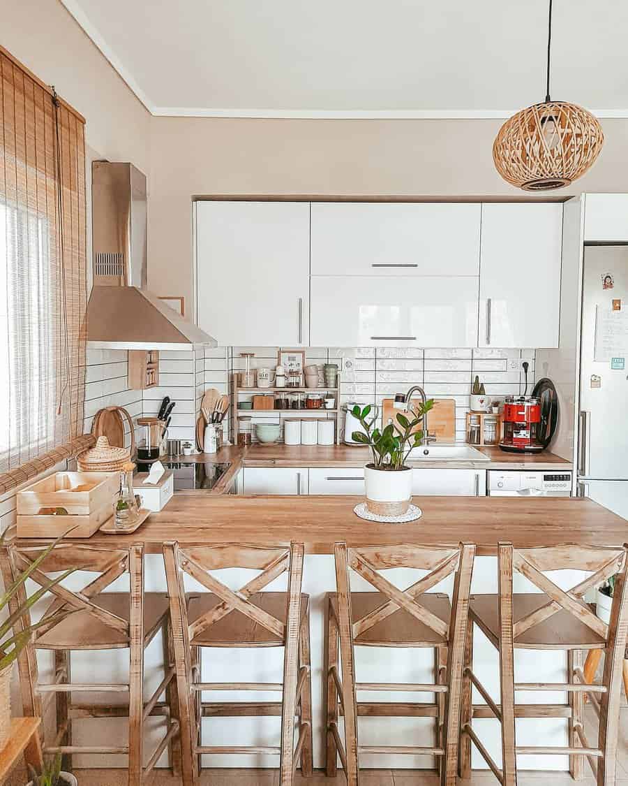 Spacious kitchen with wooden dining set and woven pendant light