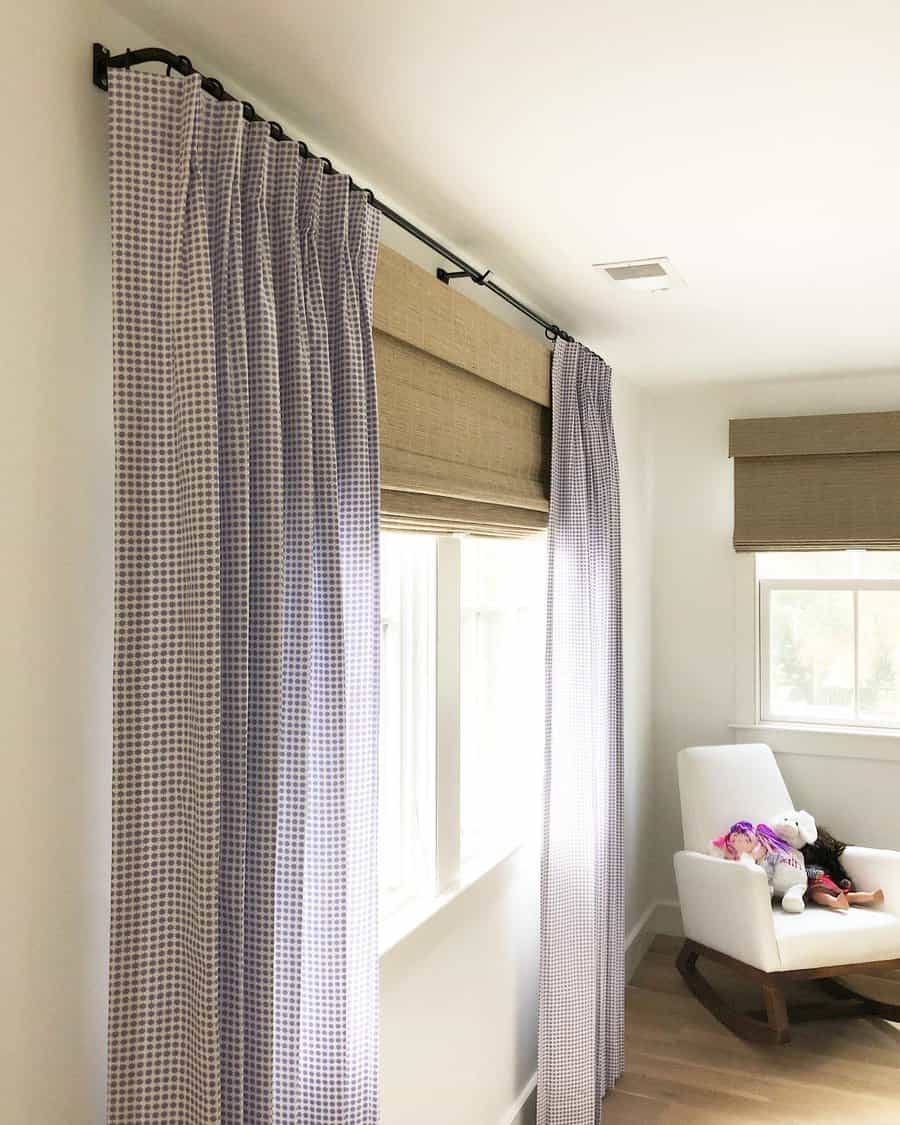 Cozy nook with checkered curtains and Roman shades