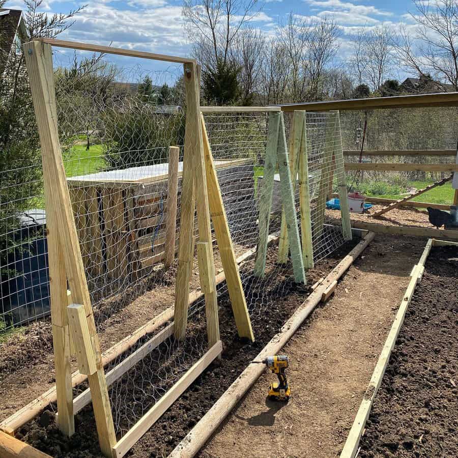 Garden trellises under construction with wire mesh