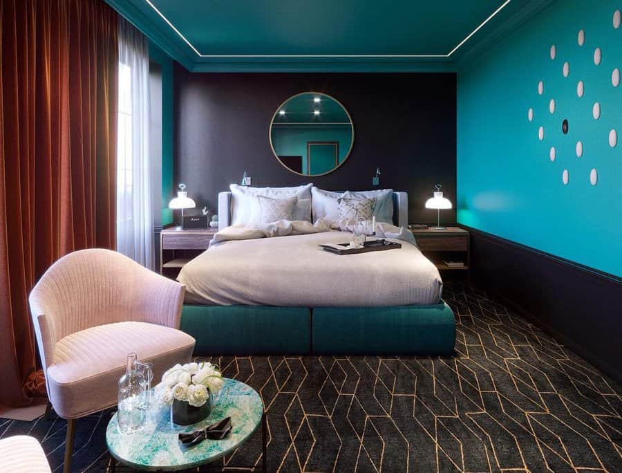 Luxurious bedroom with teal and dark walls