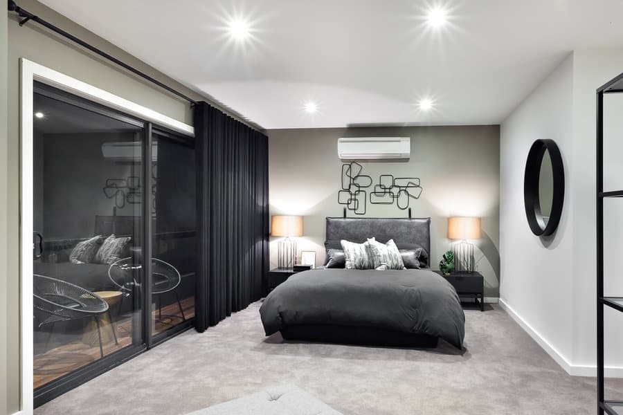 Modern bedroom with black curtains and artistic decor