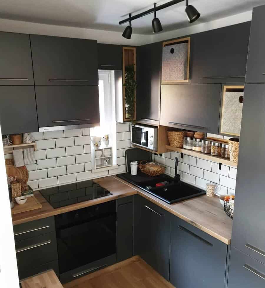 Modern kitchen with dark cabinets and subway tile backsplash