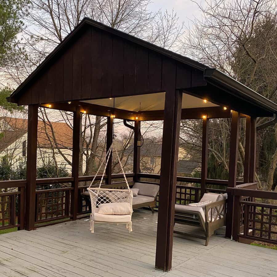 Outdoor pavilion with swing and lights