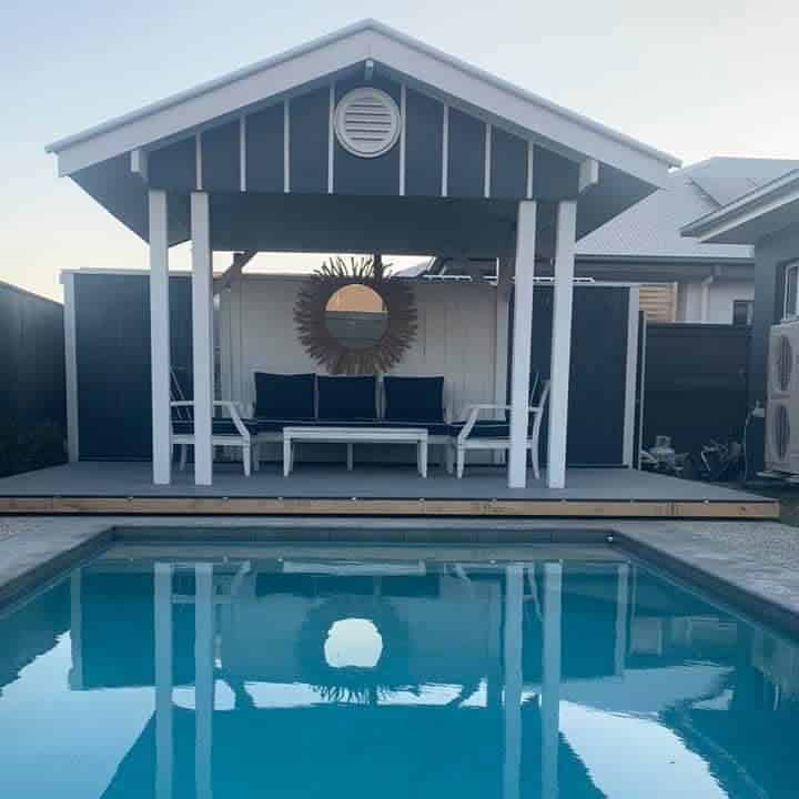 Hamptons style pool house at dusk