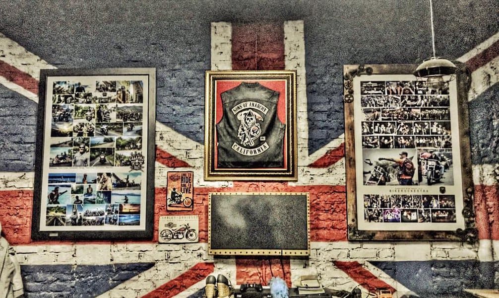 Garage wall decorated with UK flag and framed photos