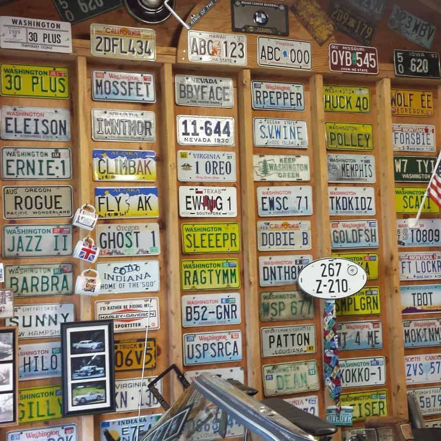 Garage wall with a collection of colorful license plates