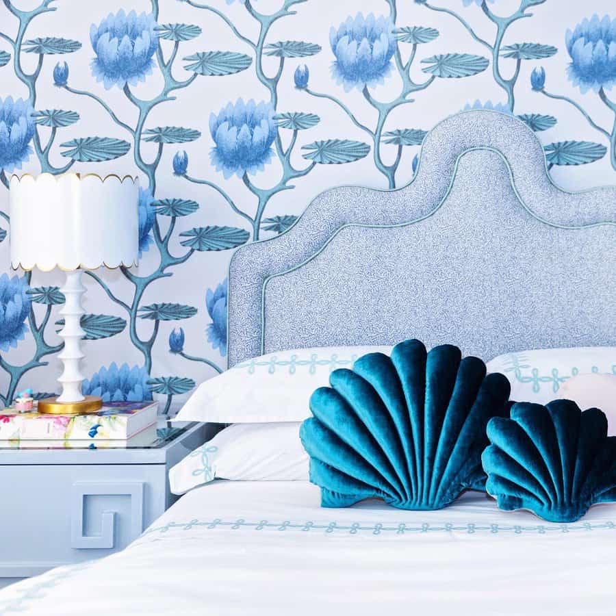 Blue and white bedroom with floral wallpaper