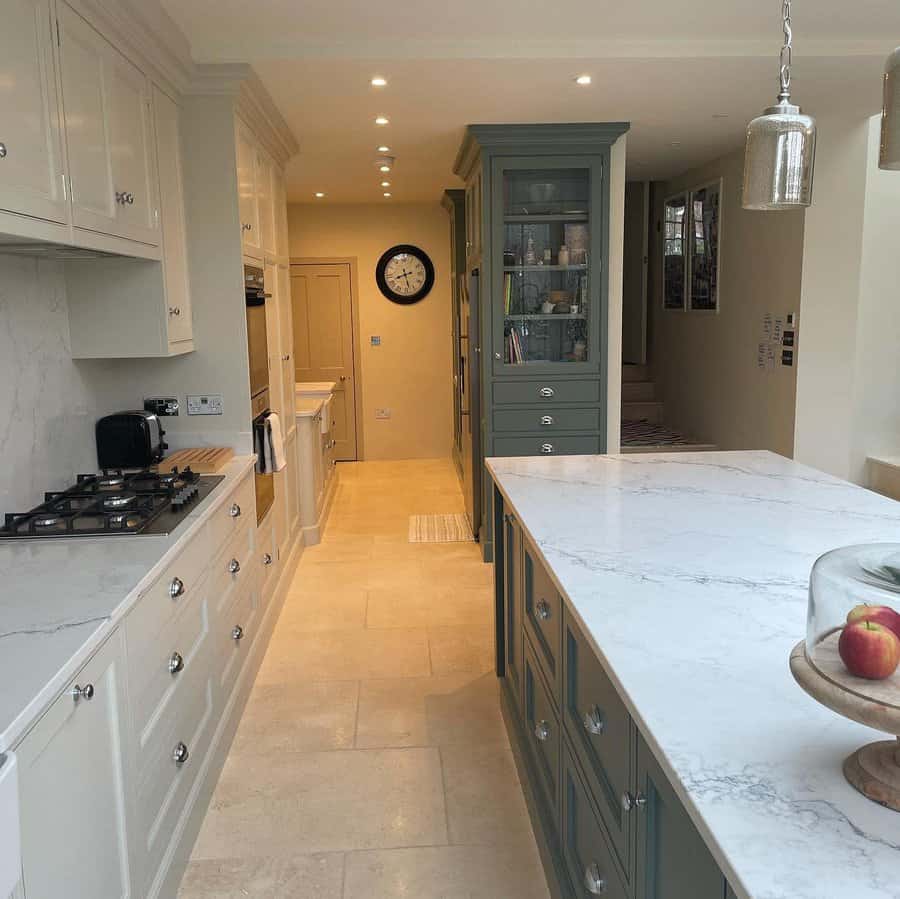 Kitchen with marble island and a spacious island