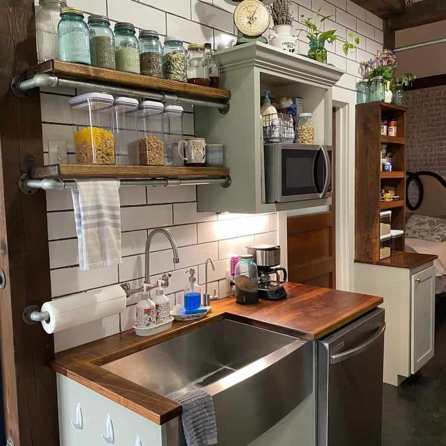 Modern kitchen featuring sink and shelves