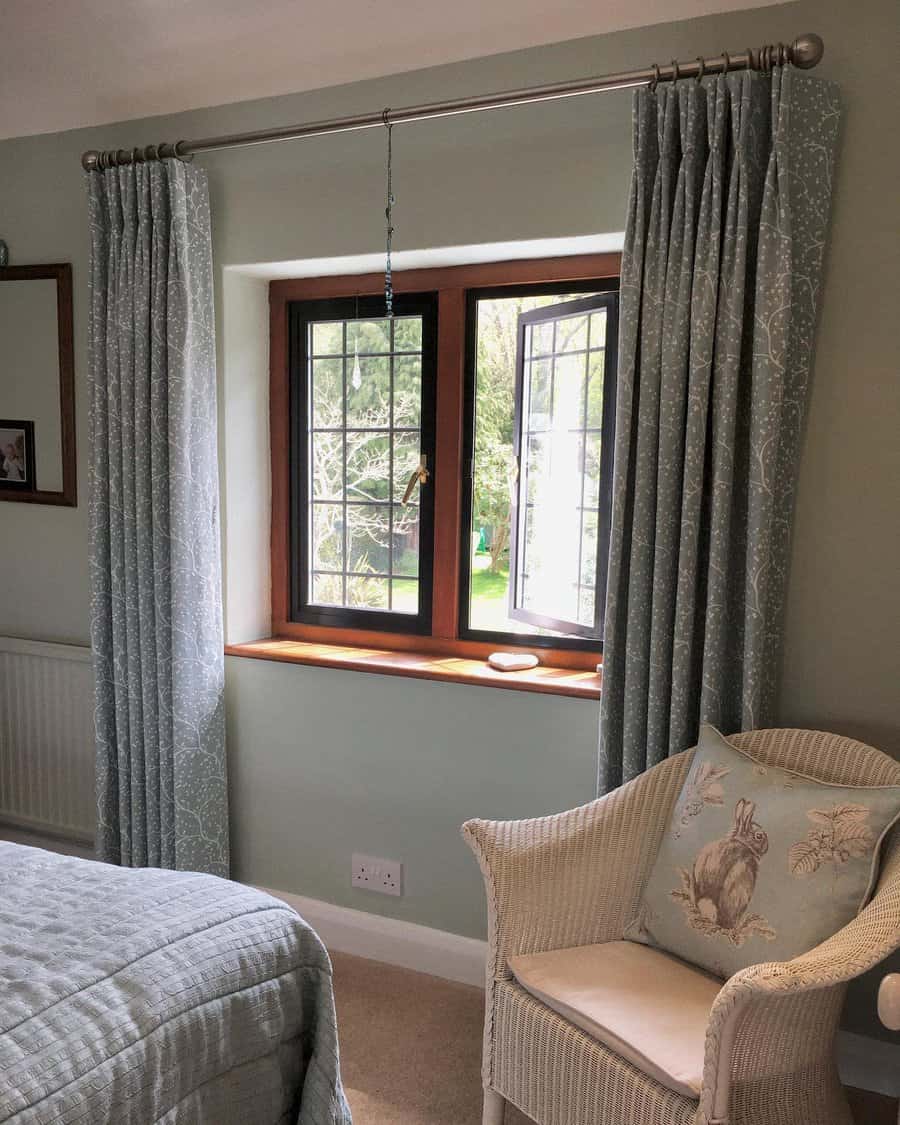 Country style bedroom with patterned grey curtains
